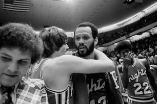 Rutgers All America forward Phil Sellers,right, gets a hug from teammate Jeff Kleinbaum after they beat Virginia Military Institute 91-75 in the NCAA East Regional championship basketball game in Greensboro, N.C., March 20, 1976.