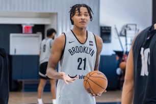 Brooklyn Nets forward Noah Clowney (21) talks to Ben Simmons (10) at training camp, Tuesday, Oct. 3, 2023, in Brooklyn, New York.
