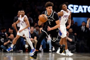 Cameron Johnson #2 of the Brooklyn Nets dribbles against the Philadelphia 76ers during the first half of Game Four of the Eastern Conference First Round Playoffs at Barclays Center on April 22, 2023