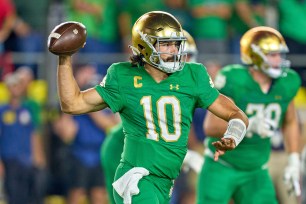 Notre Dame Fighting Irish quarterback Sam Hartman (10) throws the football in action during a football game between the Notre Dame Fighting Irish and the Ohio State Buckeyes on September 23, 2023 at Notre Dame Stadium in South Bend, IN. 
