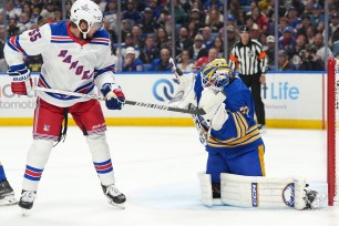 Ryan Lindgren puts a shot on Devon Levi in the Rangers' opening-night win over the Sabres Friday. The Blueshirts were without Lindgren, who was out with an upper body injury, in Saturday's loss to the Blue Jackets.