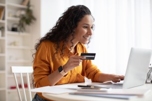 Woman compares savings account options online