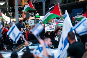 Pro-Israeli supporters confront people attending a demonstration to express solidarity with Palestinians in Gaza